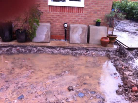The flooding from the garden in Mr Robin Watson's home in Clematis Drive in Garstang, part of the Redrow Canal View development