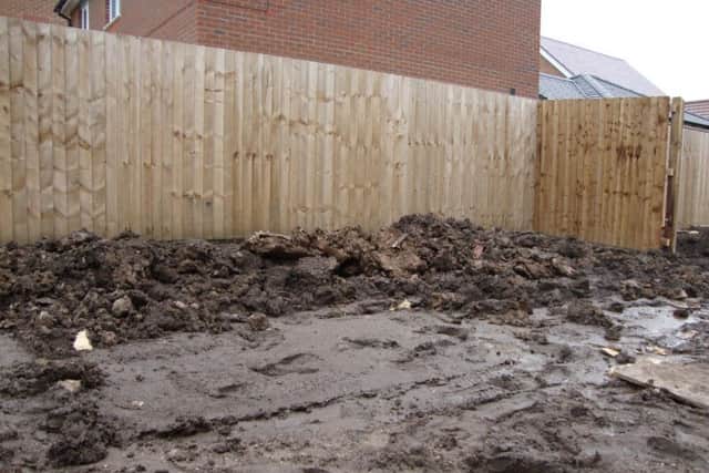 The flooding from the garden in Mr Robin Watson's home in Clematis Drive in Garstang, part of the Redrow Canal View development