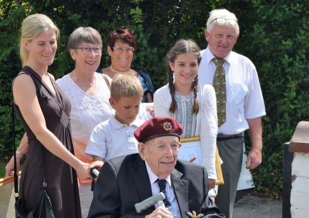 Ken Anderton (centre) surrounded by family members at his special presenation lunch