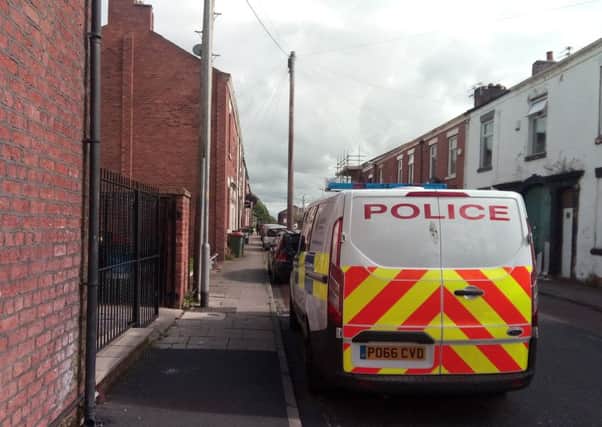 Police at the scene in Geoffrey Street, on Thursday