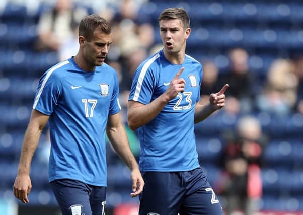 Preston North End's Tommy Spurr (left) and Paul Huntington