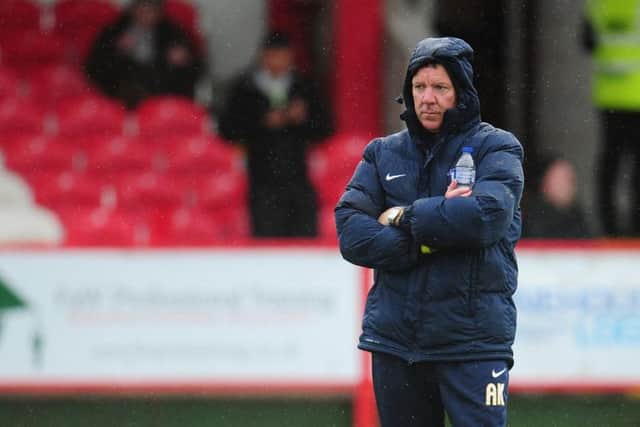 Alan Kelly oversees the warm-up before PNE's game at Accrington on Tuesday night