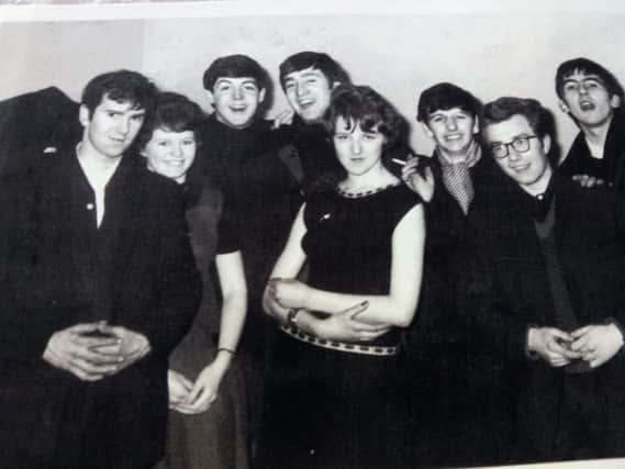David Parkes, of Ingol, (far left) with The Beatles at Morecambe Floral Hall in 1963. Also pictured is DJ Dusty Miller (with glasses)