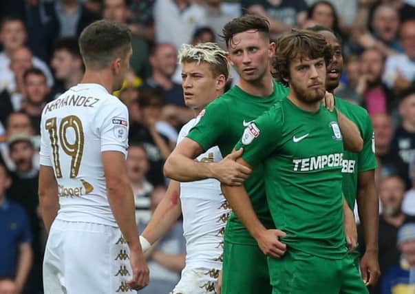 Ben Pearson is consoled by Alan Browne after being sent off at Leeds