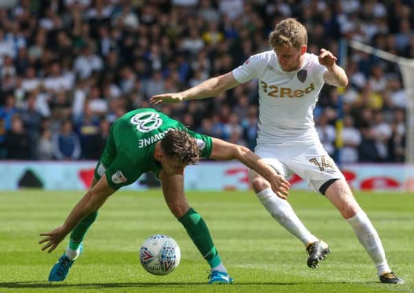 Preston North End's Alan Browne battles with Leeds United's Eunan OKane