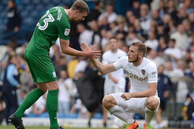 Paul Huntington shakes hands with Chris Wood at the final whistle at Elland Road.