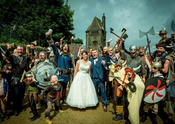 A wedding picture to remember for Sam and Anna Shepherd, whose photo shoot was invaded by Vikings. Credit: Simon Kearsley at Creative Camera