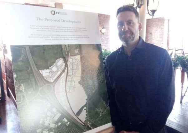 Associate development director at FI Real Estate Management Mark Adams with plans for the Botany Bay development