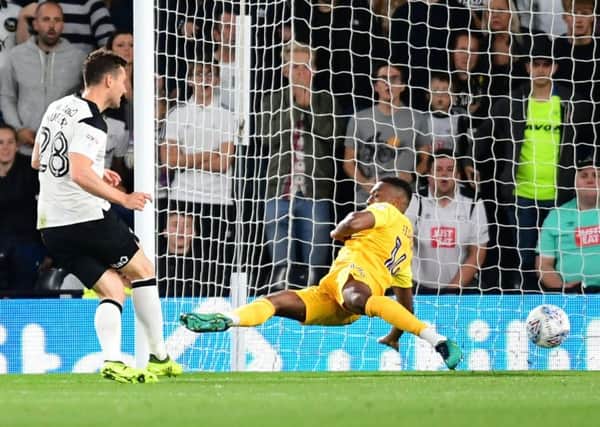 Darnell Fisher throws himself in the way of David Nugent's shot at Pride Park