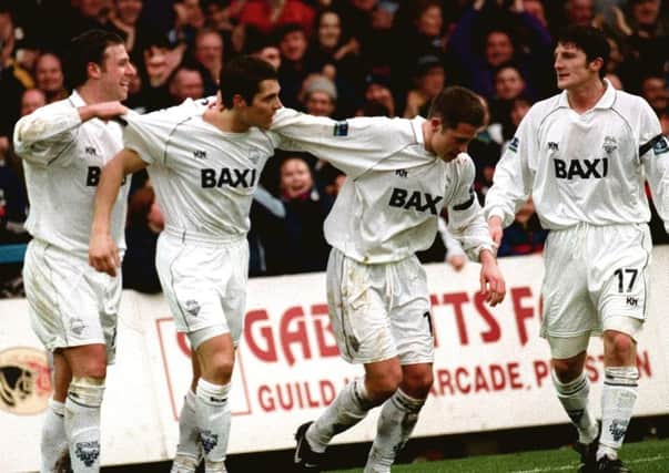 Michael Jackson (second left) is congratulated by Sean Gregan, Steve Basham and Jon Macken after scoring for PNE against Reading in 2000