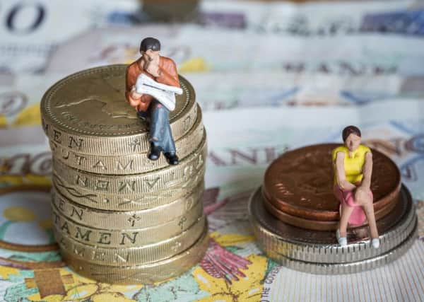 Women in Lancashire are earning more than Â£2 an hour less than men doing the same job,
