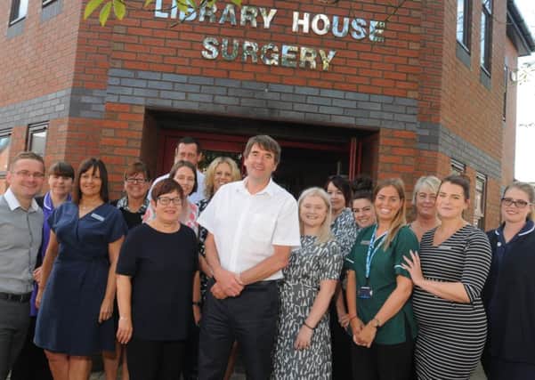 CHORLEY  17-08-17
Doctor Clive Barker, centre, is retiring after 31 years as a GP, pictured with colleagues at Library House Surgery, Chorley.