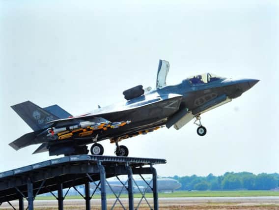 An F-35 Lightning practising ramp take-offs ready for its use on the Queen Elizabeth aircraft carrier