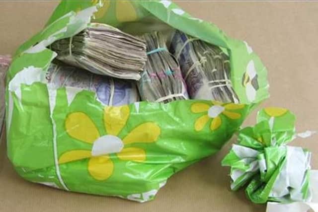 Police found nearly 164,000 in cash in Hussain and Akhtars flat.