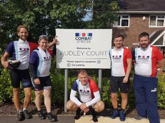 BAE Systems employees, Lee Bowen, Toby Macneil, Ryan Harris, Jonathan Hubbert, and Max Brace pictured half way through their 200 mile charity bike ride outside Combat Stresss Audley facility in Shropshire