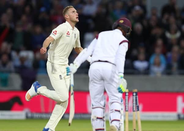 England's Stuart Broad celebrates taking the wicket of Shane Dowrich