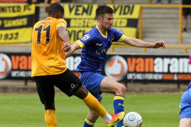Josh O'Keefe comes under pressure from Boston United