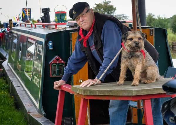 Pictures Martin Bostock. Canal Fest at Botany Bay, Chorley. Graham Keir and Billy aboard the Cut Butty.
