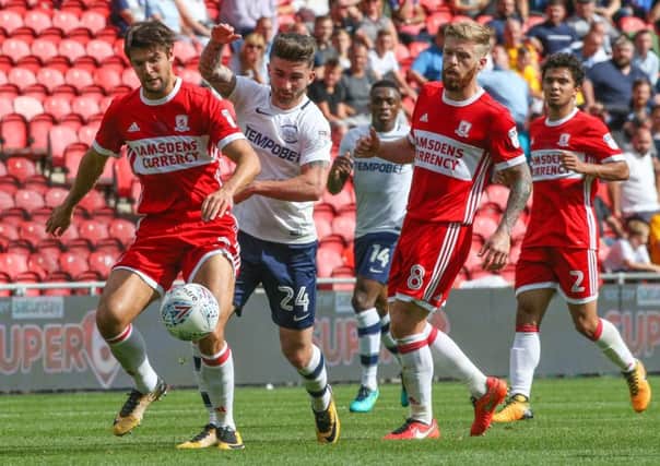 Preston North End's Sean Maguire vies for possession with Middlesbrough's George Friend