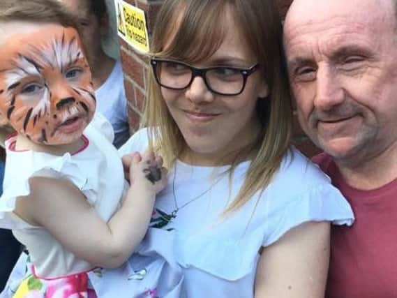 Jorgie Rae-Griffiths with dad Barry Griffiths and mum Lauren McCabe at the charity fun day at The Queen's Arms, in Kirkham