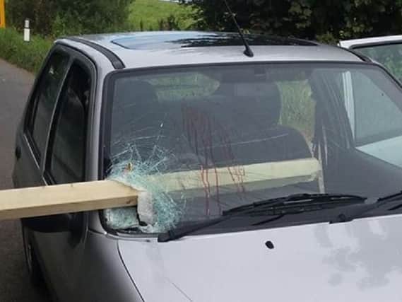 Emergency services called after a piece of timber plunged through a windscreen in Wesham
