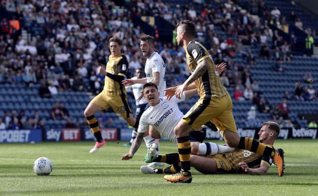 Preston North End's Jordan Hugill -  subject to much transfer talk - is brought down in the penalty area by Sheffield Wednesday's Tom Lees