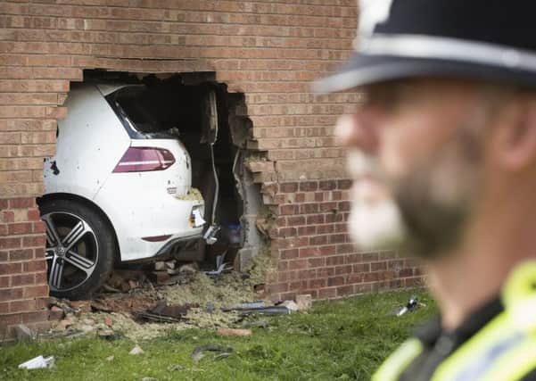 The scene in Morehall Close, Clifton, York, after a Volkswagen Golf R left the road and hit a house where a man inside the property suffered serious injuries, although they are not believed to be life threatening, PRESS ASSOCIATION Photo. Picture date: Sunday September 3, 2017. A man in his twenties, believed to be the driver of the car, has been arrested in connection with the incident. He sustained minor injuries in the collision and was taken to hospital. The two other people were in the car at the time also received medical attention. A woman who was in the house was uninjured.