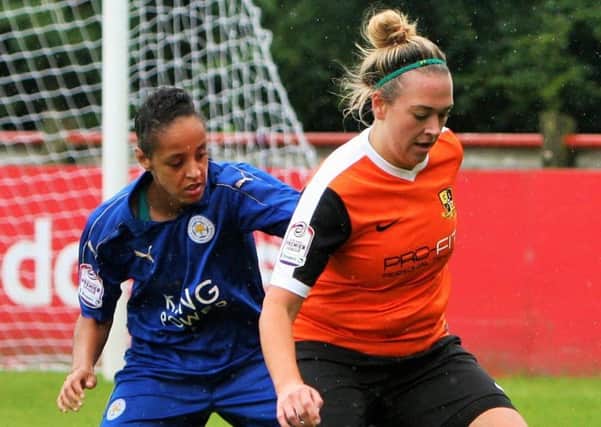 Scarlett Smith holds the ball up against Leicester City Women