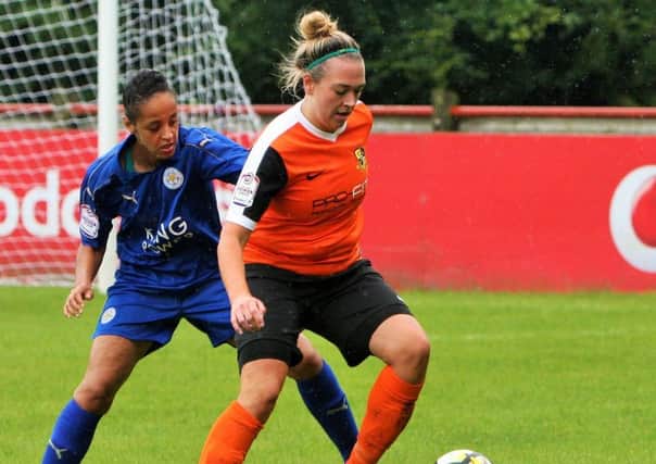 Scarlett Smith holding the ball up in attack for Chorley ladies