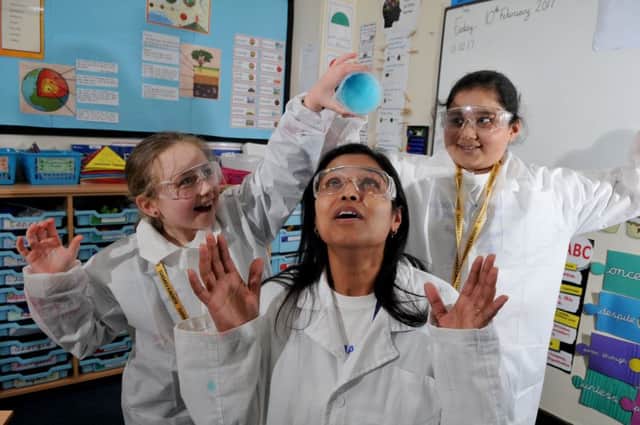 Photo Neil CrossEldon Primary holding a Super Learning Day Isobel Abbott and Khadija Hussain testing polymers with the help of Head Teacher Azra Butt