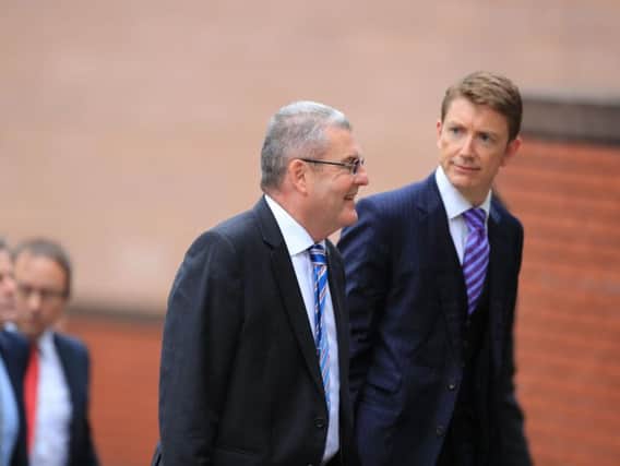 Retired police officer Donald Denton (left) arrives at Preston Crown Court where he faces charges following an investigation into the Hillsborough disaster and its aftermath.