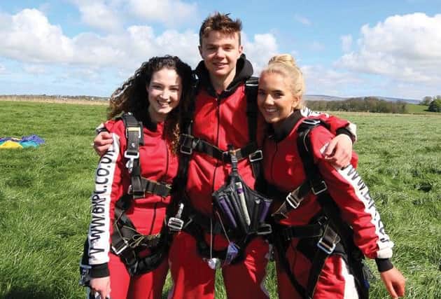 Eleanor Kirton,Henry Booth and Eden Stafford, who have done a sky dive for St Catherine's Hospice