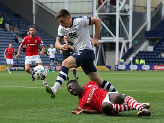 Jordan Hugill battles with Andy Yiadom during last year's meeting at Deepdale.