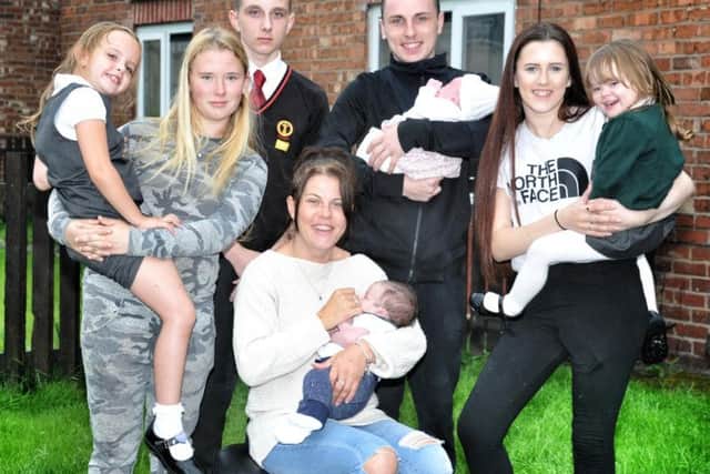 Faith (6), Nicole (17), David (14), Nathan (18) holding granddaughter Tilly (4 weeks), Megan (16), Millie (3) and Claire with four-week-old Charlie