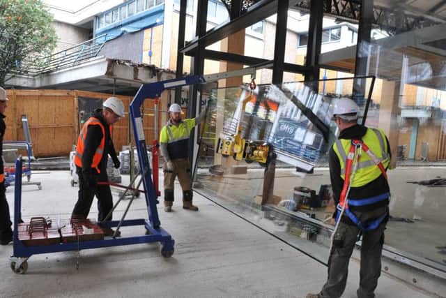 Photo Neil Cross
The first panes of glass are installed at Preston market