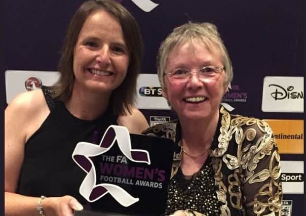 Gail Newsham (right) and Alison Hitchen pick up the award in London