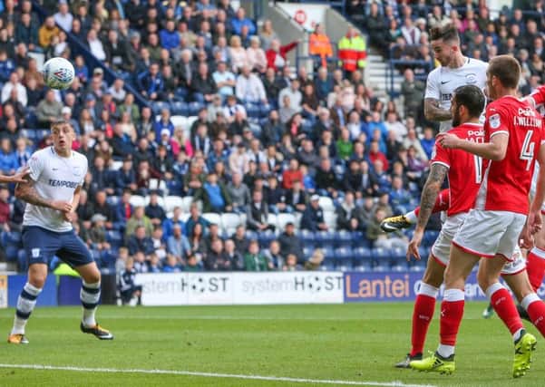 Sean Maguire jumps to head Preston in front against Barnsley
