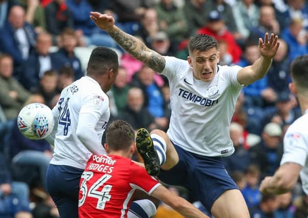 Jordan Hugill jumps for a header with Ryan Hedges and Darnell Fisher