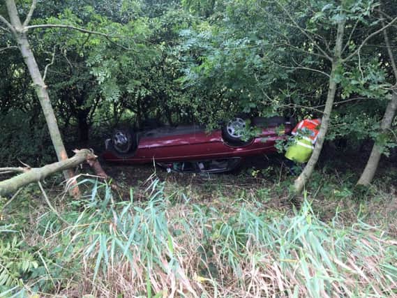 The Jag's driver was rescued after crashing into a ditch
