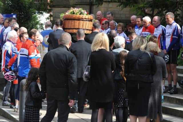 Members of Ribble Valley Cycling and Racing Club made a guard of honour to welcome the coffin followed by family members at Preston Minster