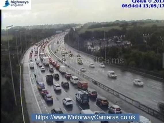 A two-car crash on the M6 is causing tailbacks