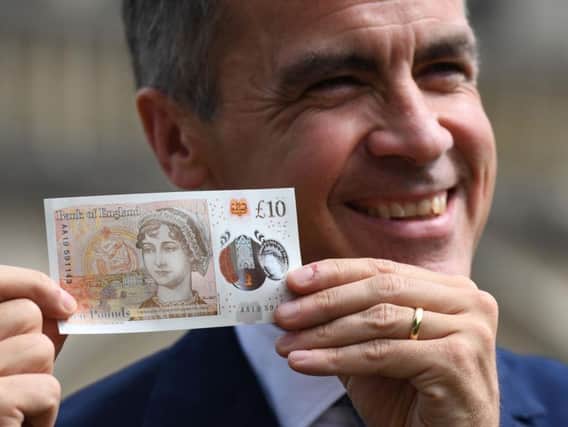 Governor of the Bank of England, Mark Carney with the new 10 note featuring Jane Austen