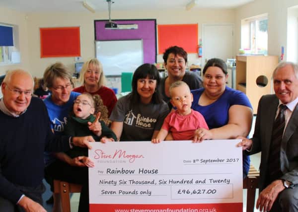 Vincent Fairclough, with Bill Ainscough  and children, parents and staff at Rainbow House, in Mawdesley
