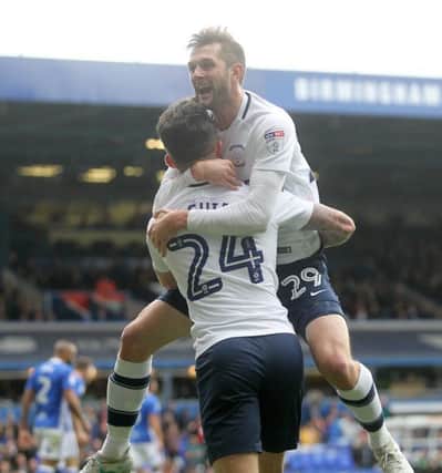 Preston North End's Tom Barkuizen celebrates scoring his side's third goal  with  Sean Maguire