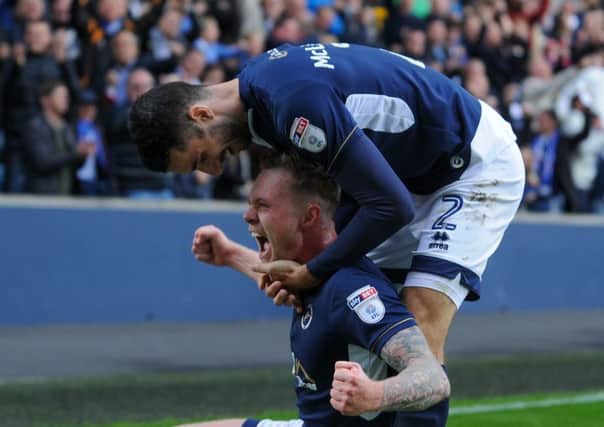Aiden O'Brien is congratulated by Conor McLaughlin after scoring Millwall's winner against Leeds