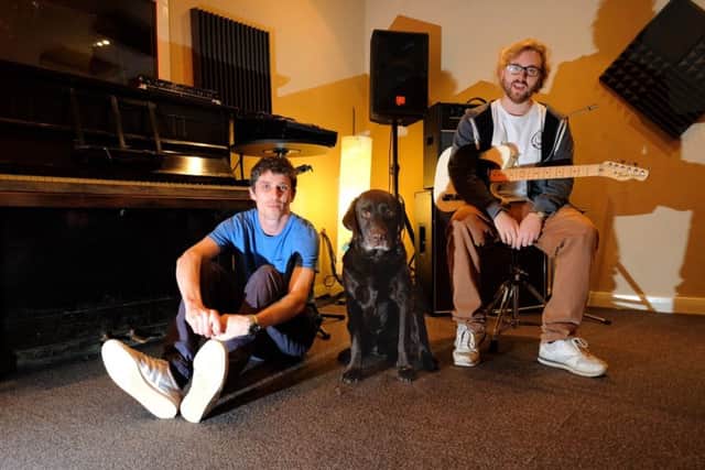 Craig Hopkinson and David Page with dog Snoop at White Bear Studios, Chorley