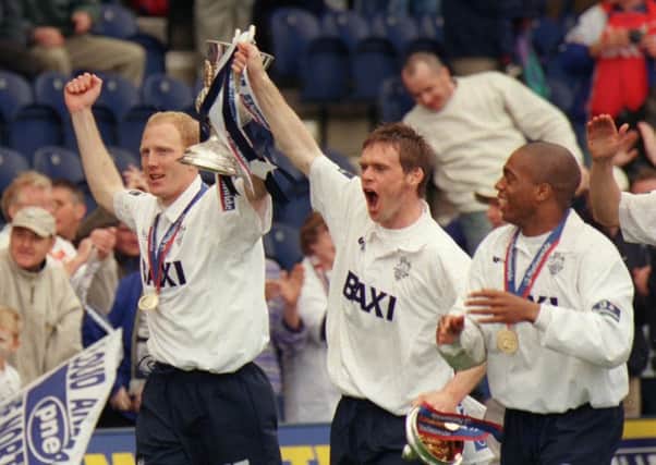 Rob Edwards and Graham Alexander parade the Second Division title trophy after PNE beat Millwall at Deepdale in April 2000