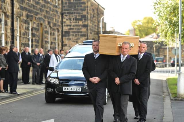 Pall-bearers carry Jim Bryson's coffin into Fulwood Barracks' Chapel