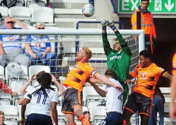 Chris Maxwell in the thick of things against Reading at Deepdale