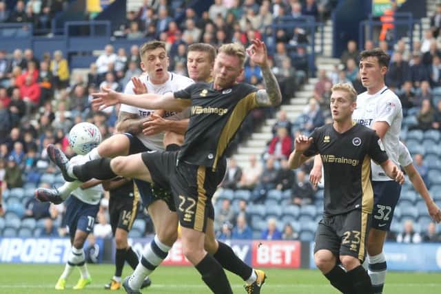 Jordan Hugill is crowded out by the Millwall defence